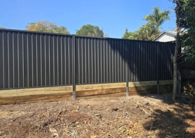 Colorbond fence with timber retaining wall in Hillcrest